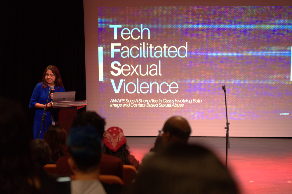 Sugidha Nithiananthan, Director of Advocacy and Research at AWARE, presenting data on tech-facilitated sexual violence at AWARE IDEVAW 2024. Photograph by Bernadette Xiao (@bernadette.xiao on Instagram).