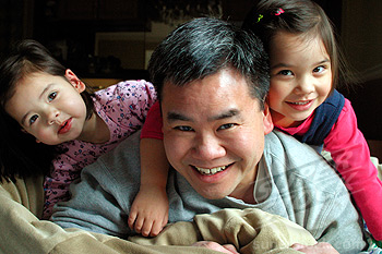 Asian Dad Playing With His Daughters