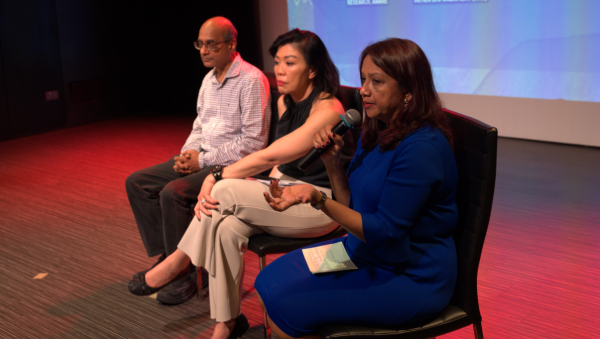 Mohan Kankanhalli, director of NUS AI Institute, Stefanie Thio, chairperson of SG Her Empowerment, and Sugidha Nithiananthan, director of advocacy and research, talking about tech-facilitated sexual violence at IDEVAW 2024. Photograph by Bernadette Xiao (@bernadette.xiao on Instagram).